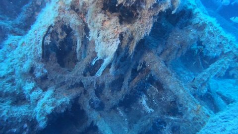 Scuba divers swims on the Shipwreck Swedish ferry MS Zenobia. Wreck diving. Mediterranean sea, Cyprus. Maritime disasters. Underwater 4K video filming Shot Of Sunken Ship. 
