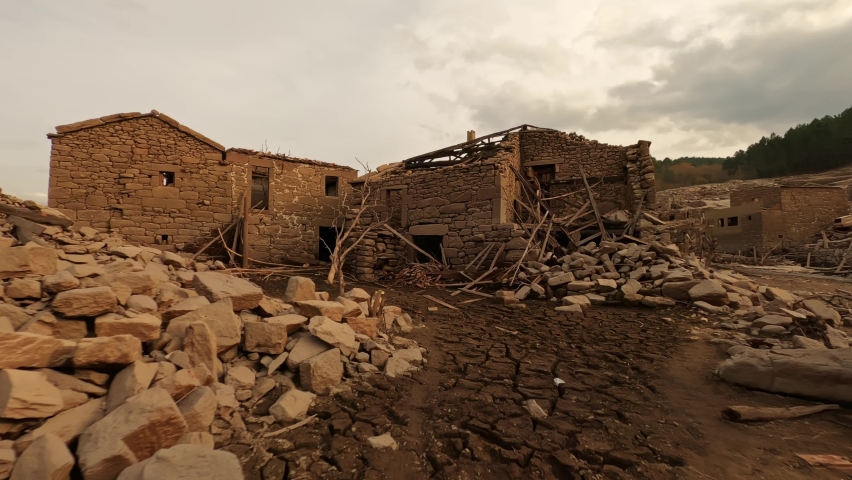 Fallen debris of destructed stone town, motion forward view