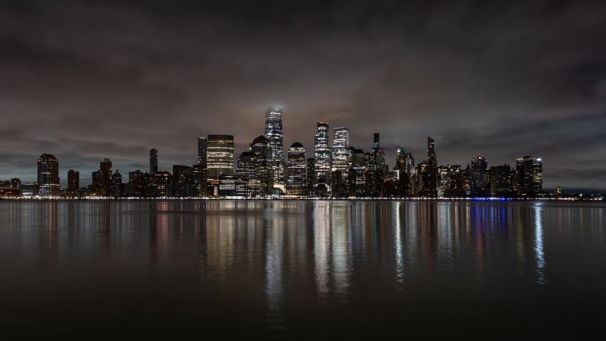 Night to Day Time Lapse of the New York Skyline with surrounding skyscrapers