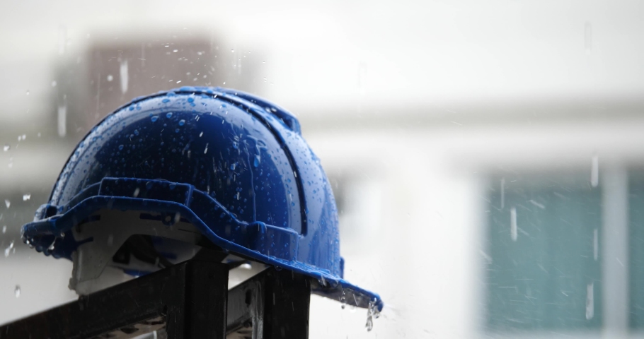 heavy rain and construction safety helmets, blue hard safety helmet and raining Royalty-Free Stock Footage #1090918281