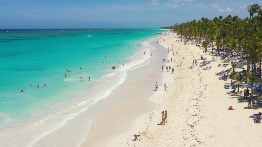 Pristine and bounty shore. Arena Gorda beach with resorts. People having fun on caribbean coastline. Aerial view from drone | Shutterstock HD Video #1090920955