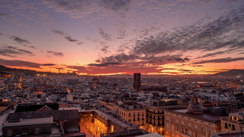Aerial view of Gothic Quarter in Barcelona. Time Lapse at sunset. Catalonia, Spain. Basilica of Santa Maria del Pi tower | Shutterstock HD Video #1090929639