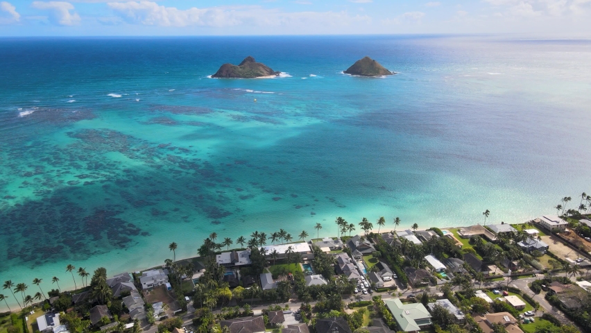 Oahu, Hawaii, USA - Feb 20 2022: Aerial view of the clear blue water in the Island of Oahu beaches. Royalty-Free Stock Footage #1090930229