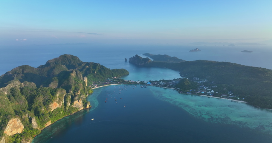 Aerial view of PhiPhi Don islands Travel Landmark of Krabi, Thailand. Amazing Drone shot of Phi Phi island with beautiful blue turquoise seawater tropical beach. Tourist attraction in summer holidays. | Shutterstock HD Video #1090937281