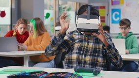 Teen girl student using vr headset and remote controllers in classroom. Modern technologies in educational process. Schoolgirl study in virtual reality goggles.  - Powered by Shutterstock - Get 15% off with code: PIKWIZARD15