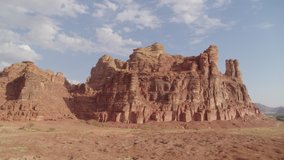 Al Ula, Saudi Arabia. High quality aerial drone video.Wide view of landscape and rock formation in the Al Ula Unesco World Heritage tourism site, landscape of sand, rocks and palm orchards.