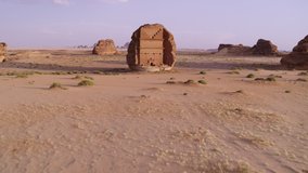 Hegra. Al Ula, Saudi Arabia. High quality aerial drone video. Nabatean tombs abd landscape in the Unesco World Heritage site, sand, rocks and mountains that are now a tourism highlight.
