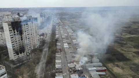 Burning buildings after explosions. Ukraine Russia war. War footages. 