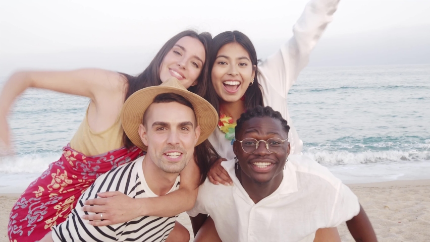 Group of diverse friends having fun at the beach. Vacation , summer, beach party Royalty-Free Stock Footage #1090969607