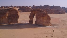 Elephant Rock, Al Ula, Saudi Arabia. Aerial view drone video. Unesco World Heritage site, a landscape of sand, rocks, canyon and tombs. Near to Hegra and a main tourist attraction.