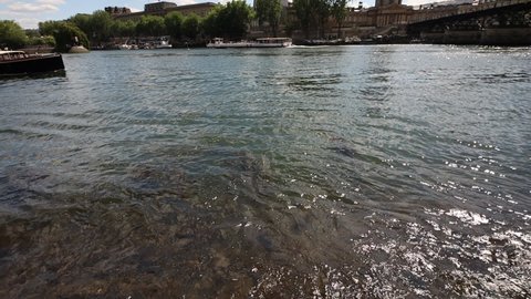 paris, france , june 2 2022 , Seine river embankments , boats and Bridge of the Arts