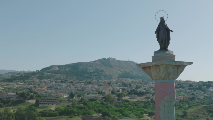 Drone shooting of the coast of Sciacca in Sicily. Harbor with fisherman, costa della volpe, castle and panoramic view of the city of Sciacca. Dixmunde sea war memorial and thermal baths.