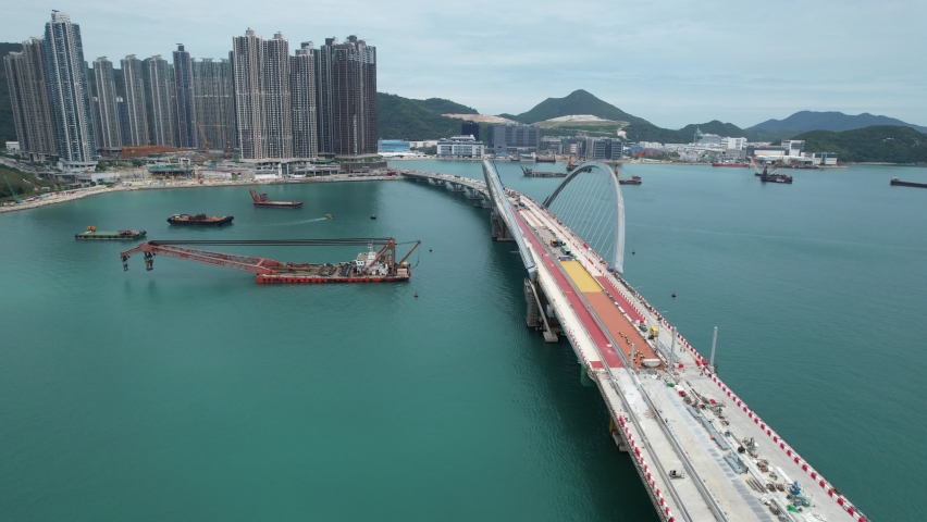 Large-scale sea traffic viaduct bridge at sea under construction in Lohas Park, Tseung Kwan O of Hong Kong city, Kowloon Aerial Drone Top view | Shutterstock HD Video #1090994897