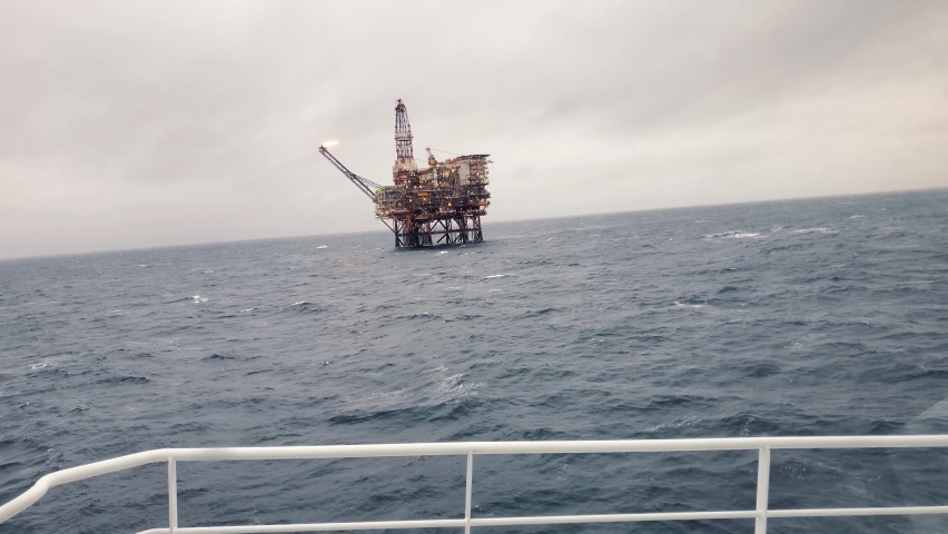 Offshore oil and gas industry. Oil platform or rig in north sea Royalty-Free Stock Footage #1090996407