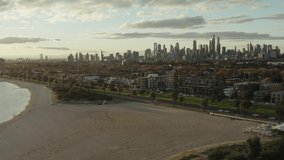 Beautiful Sunny Beach Aerial View of Melbourne City, St Kilda Beach Tourist Destination Cinematic Movement with Boats, Blue Skies and Water