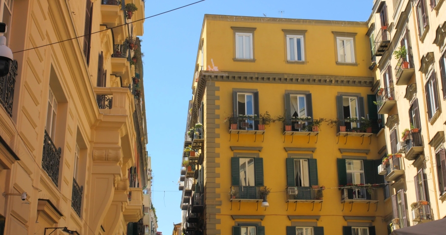 Panning across European style architecture in Chiaia district with huge windows and beautiful balconies in Naples, Italy.