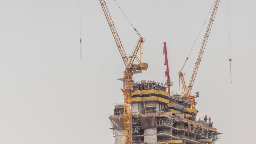 Skyscraper under construction with cranes and iron frame timelapse. Building of new multi-storey tower | Shutterstock HD Video #1091004355