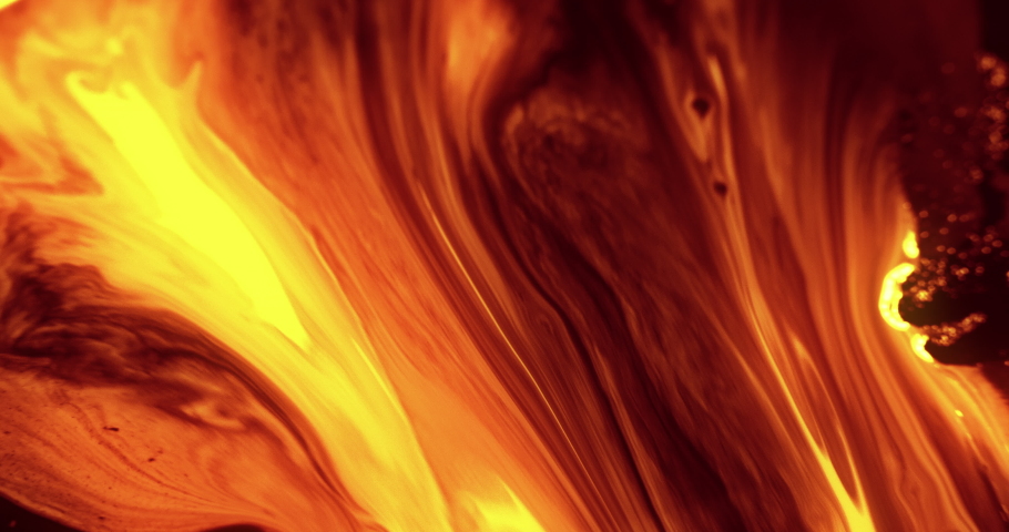 Paint flow. Hot lava effect. Orange fluid motion running downhill shot on RED Cinema camera. Royalty-Free Stock Footage #1091011901