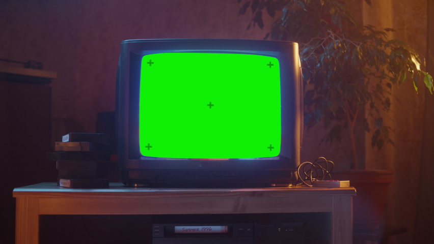 Close Up Footage of a Dated TV Set with Green Screen Mock Up Chroma Key Template Display. Nostalgic Retro Nineties Technology Concept. Royalty-Free Stock Footage #1091015813