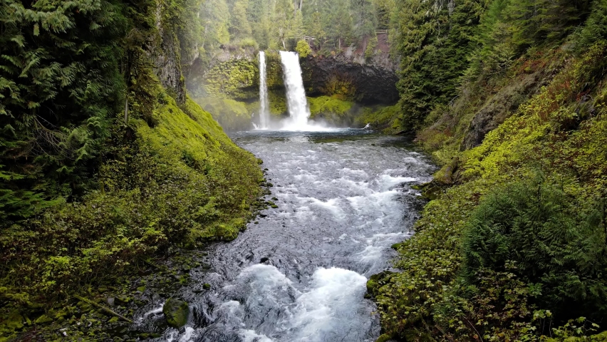 Aerial shot of the amazing Koosah Falls and lush moss covered forest on the McKenzie River in Oregon.