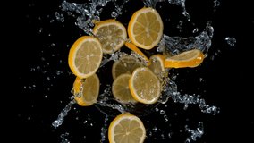 Super slow motion shot of rotating exploded lemon slices with splashing water on black at 1000fps. - Powered by Shutterstock - Get 15% off with code: PIKWIZARD15