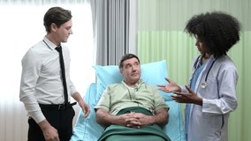 A young female doctor who specializes in heart disease. Advise patients with heart disease symptoms and the patient's son. that the results of the treatment improved until they were able to go home - Powered by Shutterstock - Get 15% off with code: PIKWIZARD15