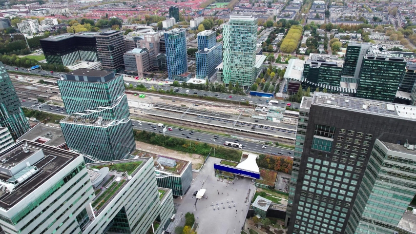 Bird's aerial view of Amsterdam Zuid Business banking district, pan, day Royalty-Free Stock Footage #1091025331