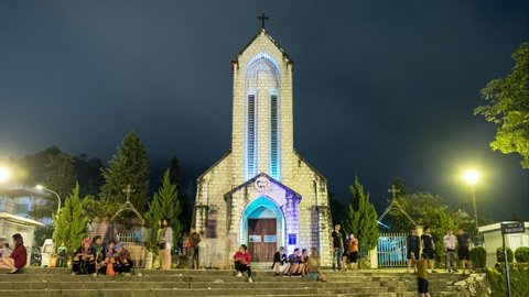 Sapa, Vietnam - Sep 07 2017 : Time-lapse of Notre Dame Cathedral or Holy Rosary Church building landmark of Sapa with tourists relaxation