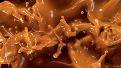 Super Slow Motion Shot of Splashing Melted Caramel at 1000 fps.