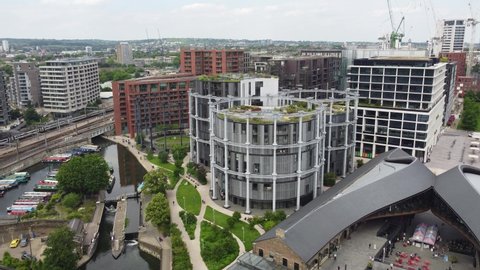 Gas holder park , and apartment conversions regents canal London Kings Cross drone aerial view