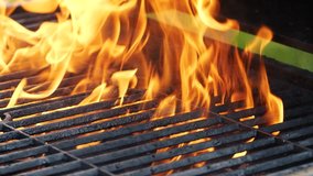 Close-up barbecue grill, slow motion night burning fire flame, cooking outdoors - Powered by Shutterstock - Get 15% off with code: PIKWIZARD15