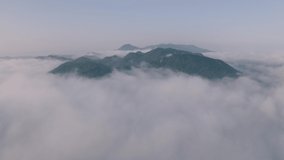 4k motion video, aerial view The beautiful morning view of the mist flowing on the high mountains due to the fresh air after the rain, Ban Pang Puai, Mae Moh, Lampang, Thailand.