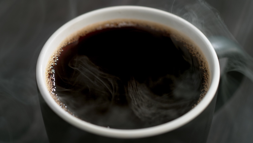 Coffee Droplet Making Splash Crown in a Cup of French Press Coffee in Slow Motion | Shutterstock HD Video #1091047041
