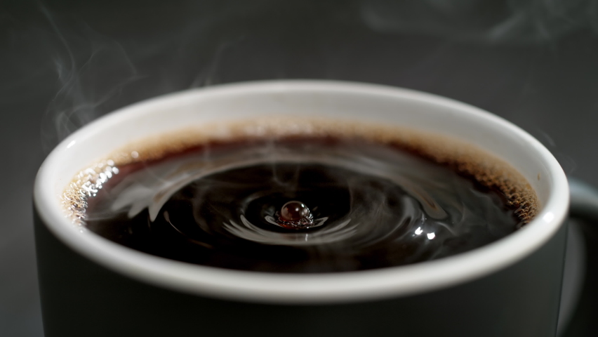 Coffee Droplet Making Splash Crown in a Cup of French Press Coffee in Slow Motion | Shutterstock HD Video #1091047041