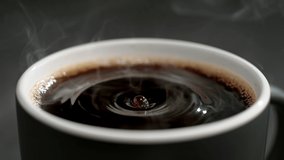 Coffee Droplet Making Splash Crown in a Cup of French Press Coffee in Slow Motion - Powered by Shutterstock - Get 15% off with code: PIKWIZARD15