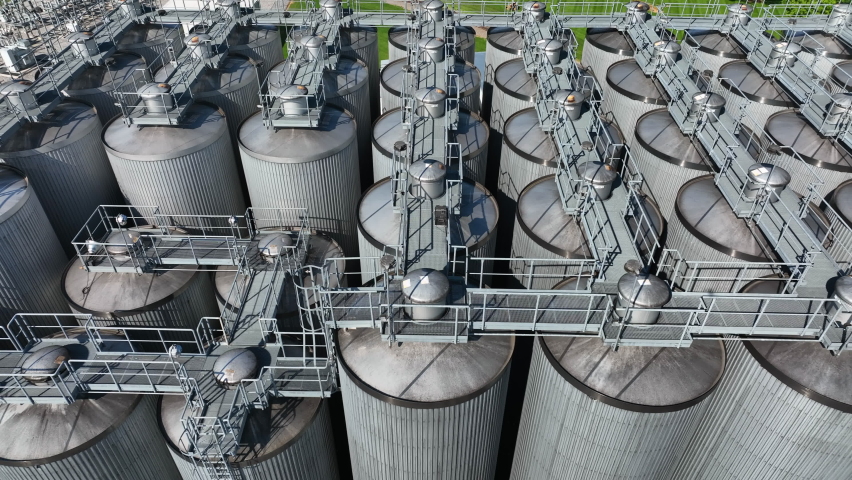 Silos and stainless steel tanks for beer fermentation. Industrial factory manufacturing in America theme. USA brewery.