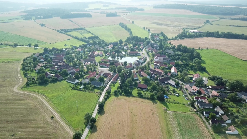 Flight over boheamian countryside with traditional village. Lipnice, Czech republic. Raw footage, no color grading. | Shutterstock HD Video #1091066967