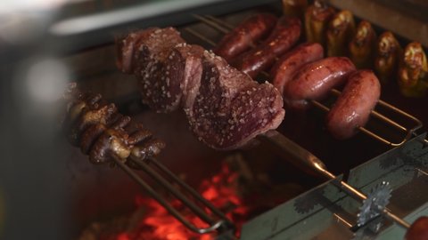Traditional Brazilian Barbecue. Picanha, sausage, chicken wings and chicken hearts. Home Grill from Brazil