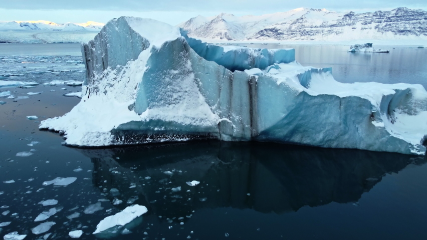 Icebergs from melting glacier in Jokulsarlon lagoon in Iceland, Arctic nature ice landscape in Unesco World Heritage Site, Drone aerial video top view - Climate Change and Global Warming Royalty-Free Stock Footage #1091068857