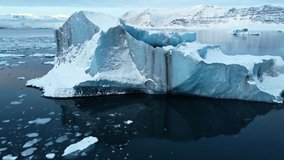 Icebergs from melting glacier in Jokulsarlon lagoon in Iceland, Arctic nature ice landscape in Unesco World Heritage Site, Drone aerial video top view - Climate Change and Global Warming