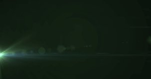 Animation of glowing green light moving on dark green background. light and movement concept digitally generated video.
