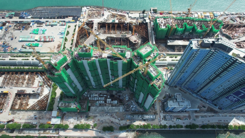 Commercial and residential construction development project in Kai Tak Cruise Terminal of Hong Kong city, Kwun Tong and Kowloon Bay near Victoria harbor, Aerial drone skyview | Shutterstock HD Video #1091072625