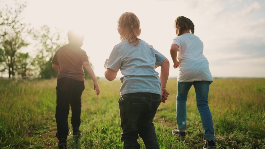 group of children a run in the park. little children are happy running on the grass in the summer playing in the forest. happy family kindergarten kids dream concept lifestyle Royalty-Free Stock Footage #1091080241