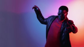 Cyberpunk party. Neon dance. Night club banner. Delighted carefree man enjoying nightlife in vivid glowing light on empty space gradient background. - Powered by Shutterstock - Get 15% off with code: PIKWIZARD15