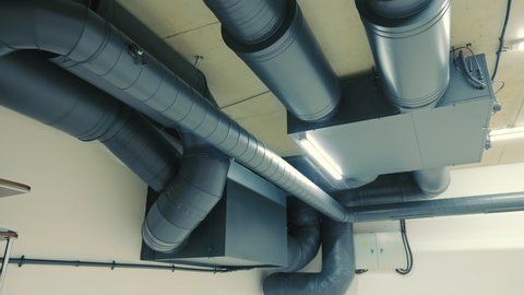 Indoor ventilation and purification system. View of the ceiling of the technical room and the installation of climate control and ventilation of rooms and rooms in the house.