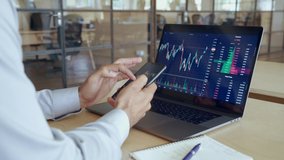 Crypto trader investor broker holding using smartphone app analyzing financial data stock market price on cell phone, checking online trading platform application, buying cryptocurrency. - Powered by Shutterstock - Get 15% off with code: PIKWIZARD15