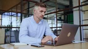 Focused middle aged business man typing on computer working in modern office. Serious busy male manager executive using software laptop analyzing digital tech data doing market research at workplace. - Powered by Shutterstock - Get 15% off with code: PIKWIZARD15
