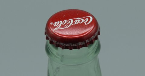 Bettendorf, Iowa - May 25, 2022 - Coca-Cola Bottle Rotating - Glass Bottle - Bottle Cap