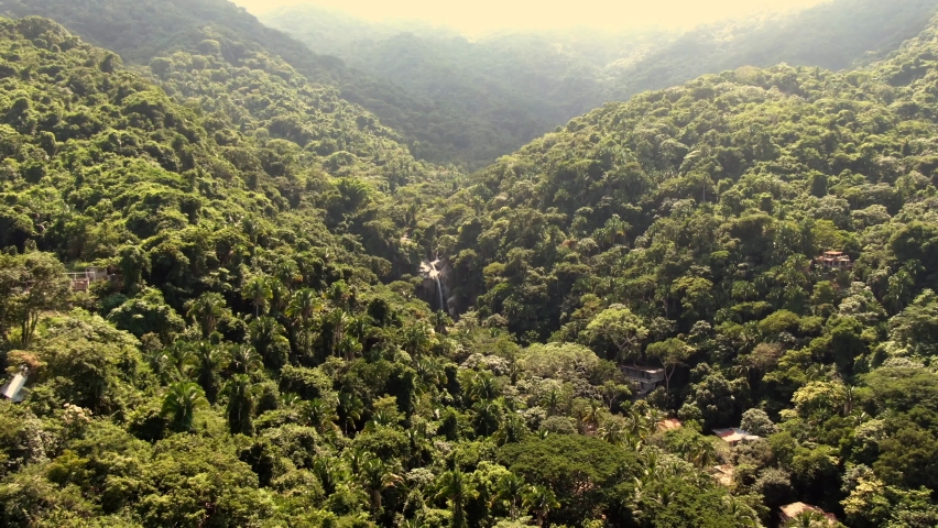 Cascada de Yelapa Amidst Tropical Rainforest Mountainscape In Jalisco, Mexico. Aerial Pullback