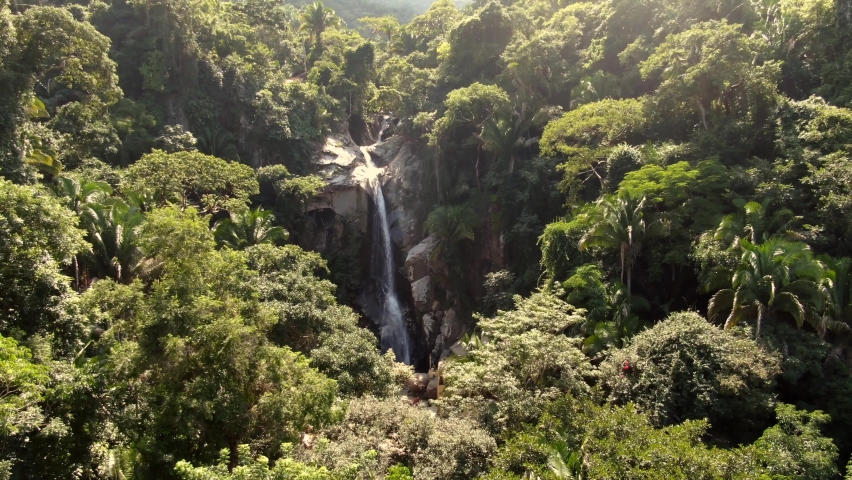 Aerial View Of Tropical Waterfall Hidden In Deep Rainforest - Cascada de Yelapa In Jalisco, Mexico.